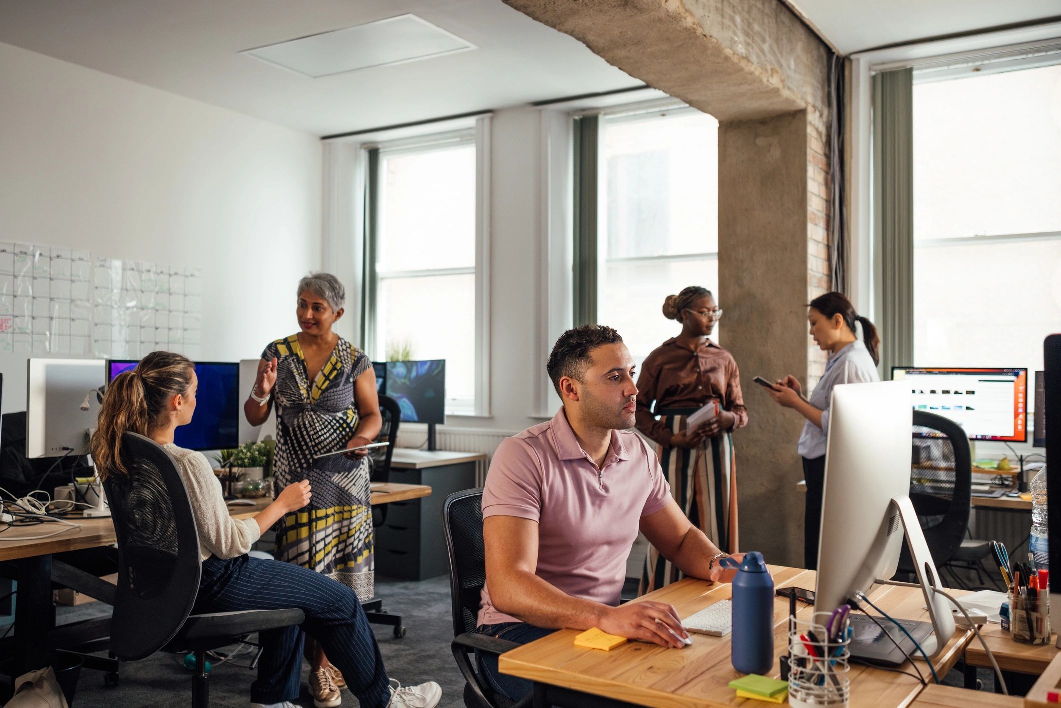 Colleagues Engaged in Office Tasks